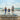 Picture of a family of three on beach.