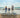 Picture of a family of three on beach.