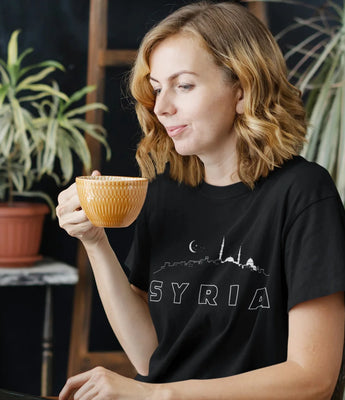 Syria-themed collection featuring t-shirts, sweatshirts, hoodies, women's tanks, eco tote bags, and mugs with Syrian cultural designs.