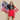 Woman holding the USA flag while wearing a unisex t-shirt with a Statue of Liberty design.