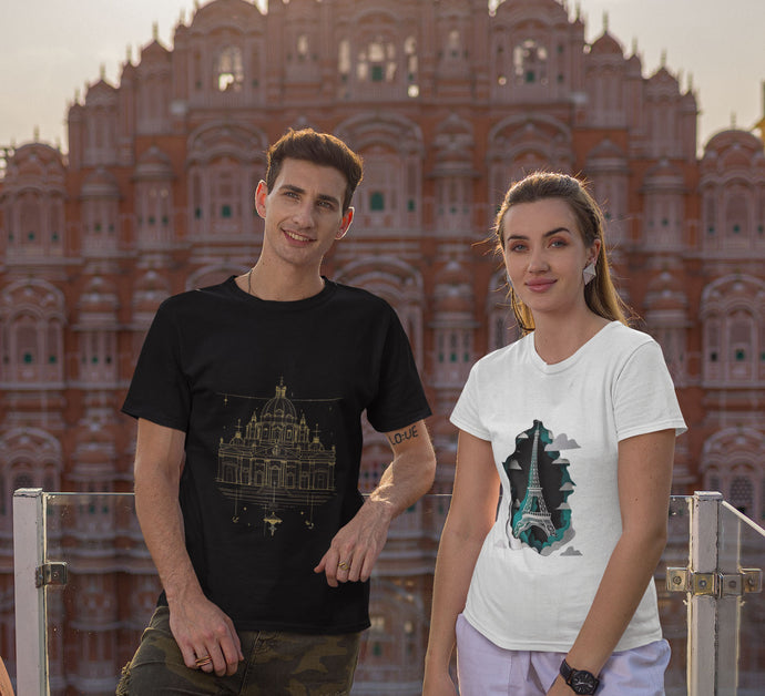 Man and woman wearing unisex t-shirts featuring architectural designs.