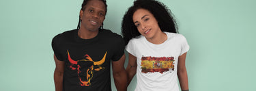 Man and woman wearing unisex t-shirts with vibrant Spain-inspired designs.