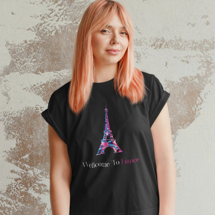 Woman wearing a t-shirt with an Eiffel Tower print, styled casually to showcase a stylish and iconic Parisian design.